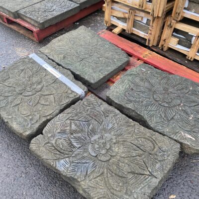 grey stone paver hand carved with floral design