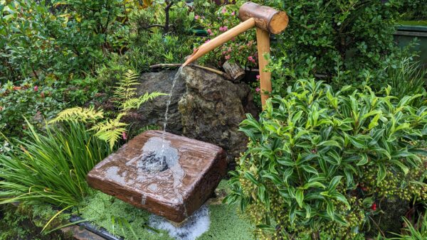 Bamboo spout with wooden bowl