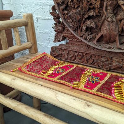 Wooden bench with colourful cloth on it